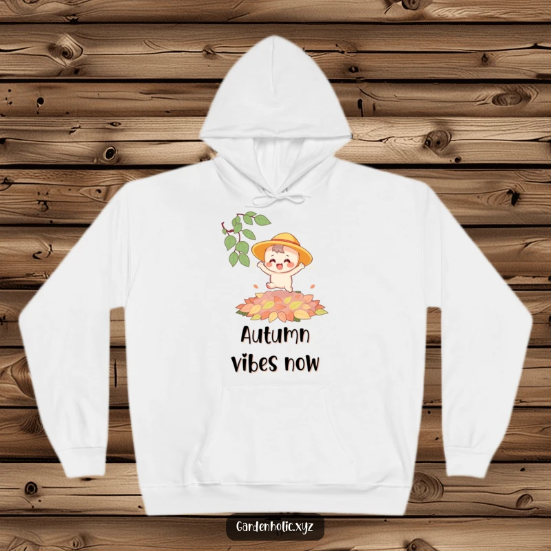 Funny hoodie showing a happy character with a sun hat joyfully leaping on a large, plush pile of colorful autumn leaves.