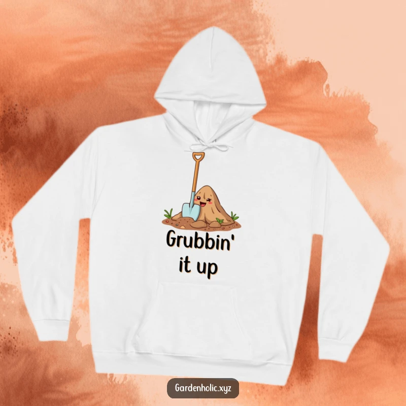 Funny Hoodie: A happy cartoon trowel digs into soil, designed for cozy gardening vibes and humor.