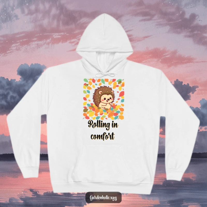 Funny hedgehog hoodie featuring a happy hedgehog rolling joyfully through a pile of colorful autumn leaves, perfect for cozy fall days.
