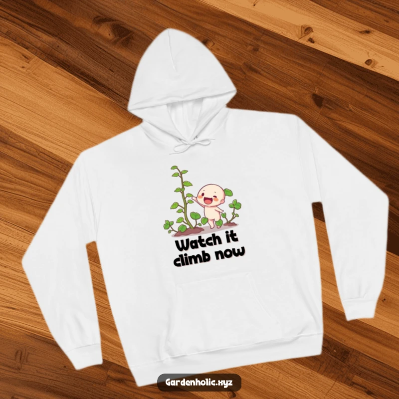 Funny hoodie with a character pointing animatedly at a thick, rapidly growing vine, bringing warmth and humor to any plant lover.